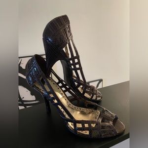 Brown snake skin, BCBG heels. Size 9.
